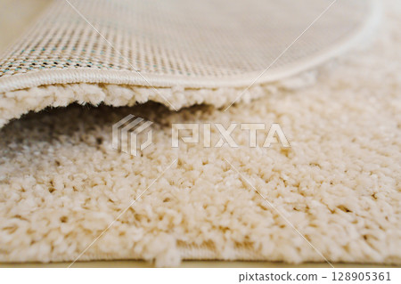 close-up. beige Interior pile carpet made of polypropylene. close-up. beige Interior pile carpet made of polypropylene. 128905361