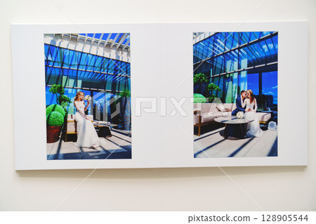 the pages of a photo book with wedding photos. the pages of a photo book with wedding photos. 128905544