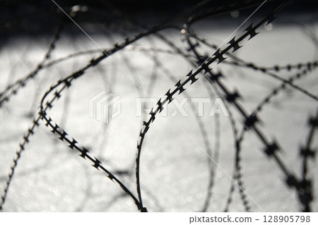Barbed wire on snow Barbed wire on snow 128905798