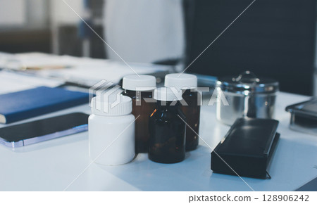 Young brunette woman having consultation at doctor office during Young brunette woman having consultation at doctor office during 128906242