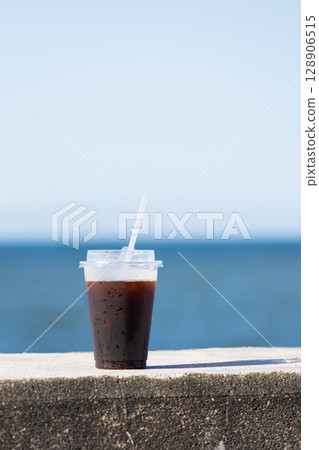 Cold iced coffee on the beach in midsummer 128906515