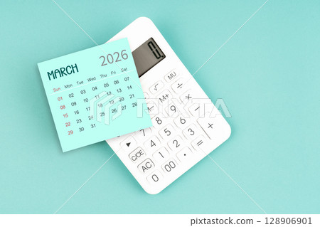 March 2026 calendar card with calculator on blue color background. March 2026 calendar card with calculator on blue color background. 128906901