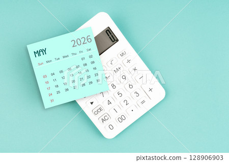 May 2026 calendar card with calculator on blue color background. May 2026 calendar card with calculator on blue color background. 128906903