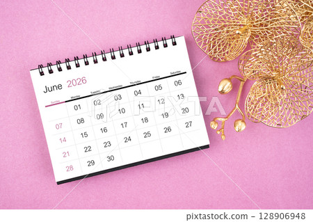 June 2026 desk calendar with golden orchid on pink color background. June 2026 desk calendar with golden orchid on pink color background. 128906948