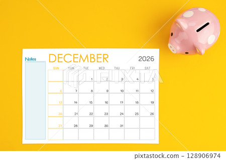 December 2026 calendar and pink piggy bank. Money savings challenge concepts. 128906974