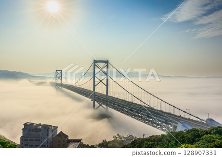 A fantastical view of the Naruto Bridge floating in the mist 128907331