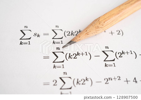 Pencil on mathematic formula exercise test paper in education school. 128907500