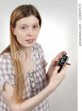 Scammer calling on phone Scammer calling on phone 128907573