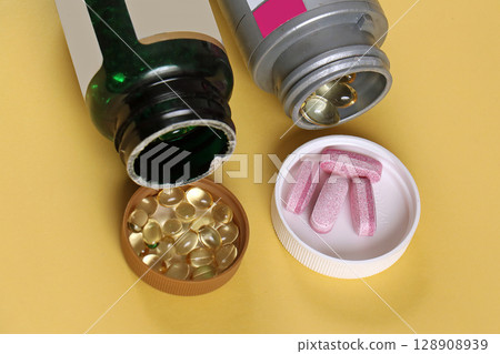 Multivitamins dietary supplement pills 128908939