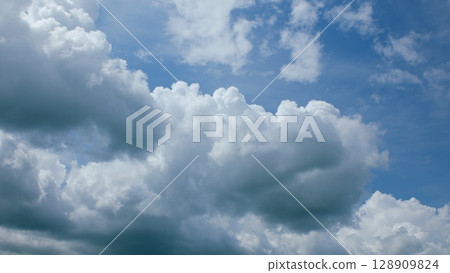 Vibrant and Colorful Cloudscape Under a Gorgeous Clear Blue Sky, Full of Life and Light Vibrant and Colorful Cloudscape Under a Gorgeous Clear Blue Sky, Full of Life and Light 128909824
