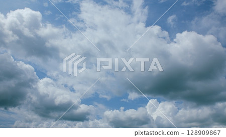 Vibrant Dynamic Cloudscapes Set Against Stunningly Bright Blue Skies Full of Life 128909867