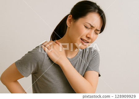 Middle-aged woman suffering from shoulder pain Middle-aged woman suffering from shoulder pain 128909929