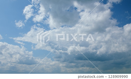 A Beautiful Cloudy Sky with a Soft Light Blue Background Radiating Calmness and Serenity A Beautiful Cloudy Sky with a Soft Light Blue Background Radiating Calmness and Serenity 128909990