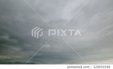 An overcast sky with swirling clouds that evoke feelings of drama and tranquility 128910166