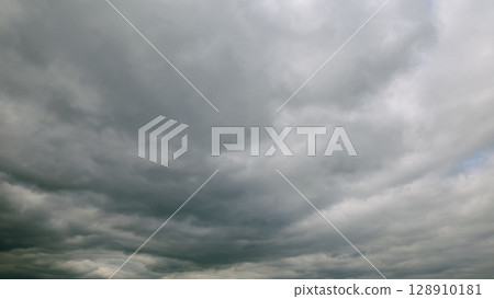 The Dramatic Overcast Sky Exhibits Rolling Clouds in a Captivating Display of Natures Mastery 128910181