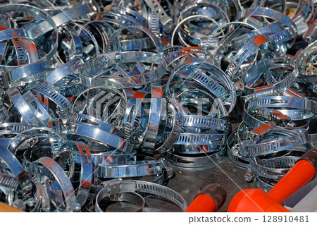 Metal hose clamps pile Metal hose clamps pile 128910481
