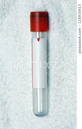Empty test tube on white material 128910913