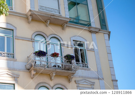 Elegant European Apartment Building with Balcony and Flower Boxes Elegant European Apartment Building with Balcony and Flower Boxes 128911866