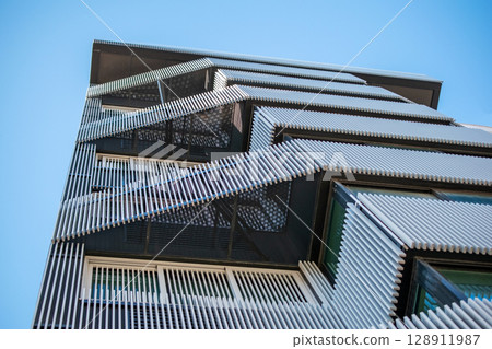 Modern Architectural Facade with Slatted Screens Modern Architectural Facade with Slatted Screens 128911987