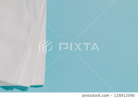 Stack of White Fabric on Blue, Cleanliness and Texture 128912090