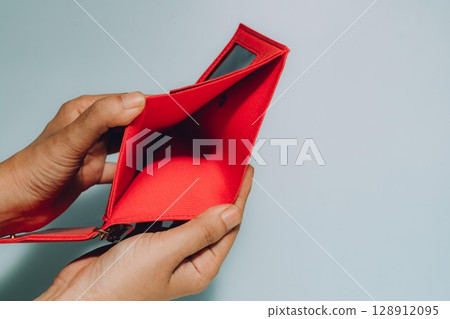 Empty Red Wallet in Hands, Financial Hardship and Budgeting Empty Red Wallet in Hands, Financial Hardship and Budgeting 128912095