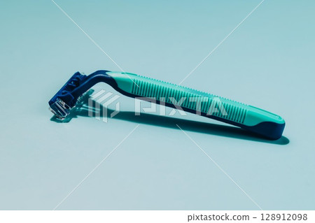 Blue and Green Razor on Blue, Shaving and Personal Care Blue and Green Razor on Blue, Shaving and Personal Care 128912098