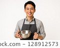 A young male instructor at a cooking class and cooking utensils 128912573