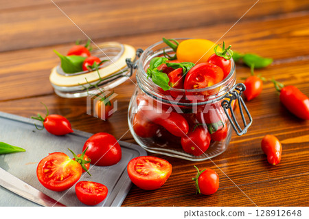 Organic garden tomatoes variety with seeds and pulp Organic garden tomatoes variety with seeds and pulp 128912648