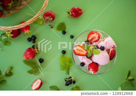 Summer dessert with berries on a green background Summer dessert with berries on a green background 128912668