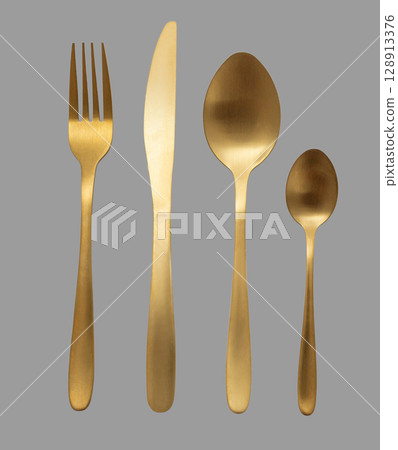 Golden cutlery set including fork, knife, and spoons on transparent background Golden cutlery set including fork, knife, and spoons on transparent background 128913376