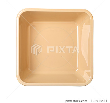 Light brown plastic basin isolated 128913411