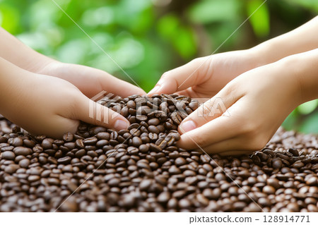 Hands cup fresh coffee beans outdoors in natural sunlight with blurred greenery behind Hands cup fresh coffee beans outdoors in natural sunlight with blurred greenery behind 128914771