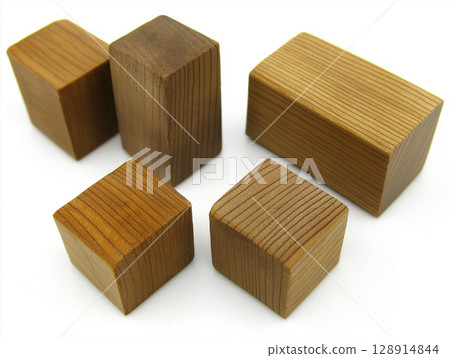 Collection of wooden blocks arranged on a white background showcasing different textures and shapes 128914844