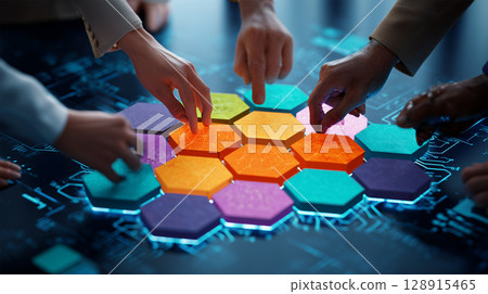 Members working together to fit the hexagonal pieces together 128915465
