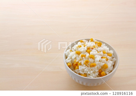Corn mixed rice on table background 128916116