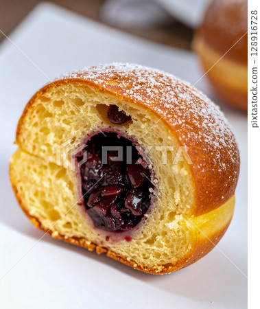 A doughnut without a hole, filled with sweet bean paste 128916728