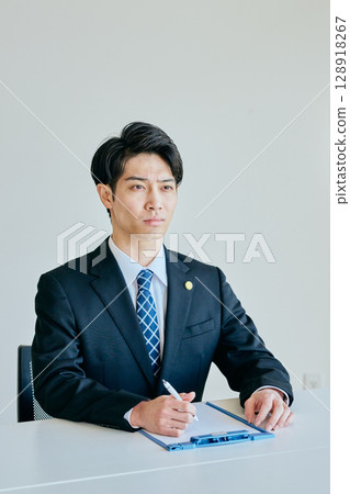 young lawyer receiving legal advice young lawyer receiving legal advice 128918267
