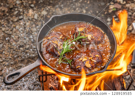 Hamburger Grilling homemade hamburger steaks outdoors Hamburger Grilling homemade hamburger steaks outdoors 128919585