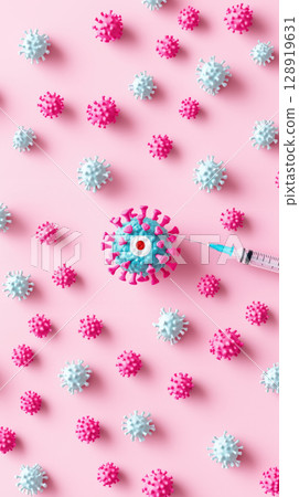 Colorful virus models with target medicine syringe on pink background, symbolizing vaccination 128919631