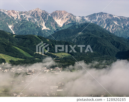 Beautiful sea of clouds and the Hakuba Sanzan mountains, Hakuba Village, Nagano Prefecture (aerial shot by drone) 128920285