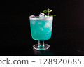 Cocktail photographed against a black background 128920685