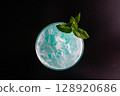 Cocktail glass garnished with mint and mint leaves 128920686