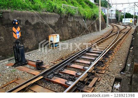A spring point at a signal box is a device that allows trains to pass each other on a single track. 128921398