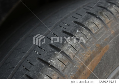 dirty black tire car texture, transportation industry 128921581