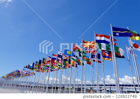 2025 Osaka Kansai Expo: International flags fluttering at the West Gate, Yumeshima, Konohana Ward, Osaka City 128922749