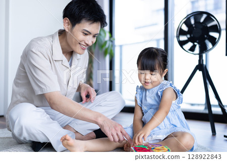 Dad and daughter having fun Dad and daughter having fun 128922843