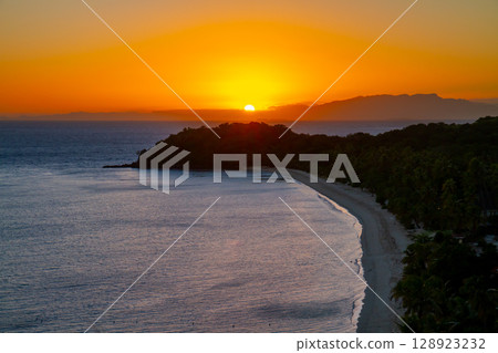 Oceania, Fiji, Republic of Viti Levu, west off the coast of the Mamanuca Islands, dawn on North Beach from the observation deck on Mana Island 128923232