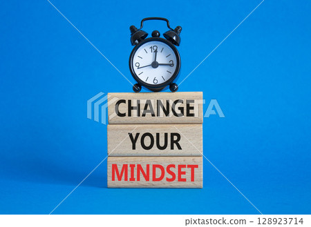Change your mindset symbol. Concept words Change your mindset on wooden blocks with alarm clock. Beautiful blue background. Business and Change your mindset concept. Copy space. Change your mindset symbol. Concept words Change your mindset on wooden blocks with alarm clock. Beautiful blue background. Business and Change your mindset concept. Copy space. 128923714