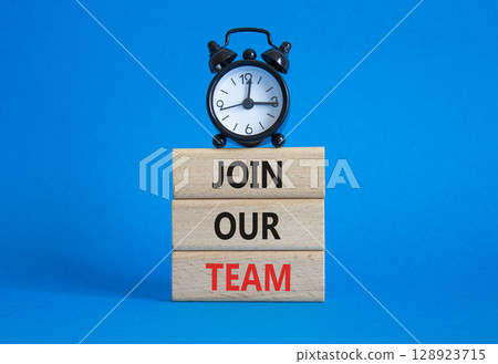 Join our team symbol. Wooden blocks with words Join our team. Beautiful blue background with alarm clock. Business and Join our team concept. Copy space. Join our team symbol. Wooden blocks with words Join our team. Beautiful blue background with alarm clock. Business and Join our team concept. Copy space. 128923715