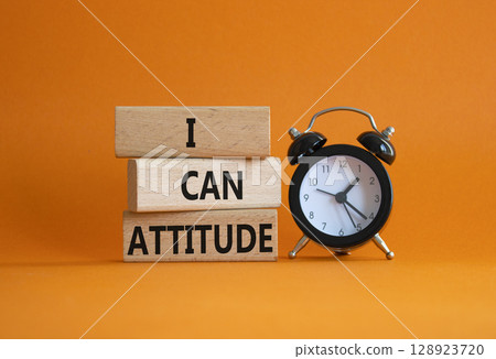 I Can Attitude symbol. Wooden blocks with words I Can Attitude. Beautiful orange background with alarm clock. Business and I Can Attitude concept. Copy space. 128923720